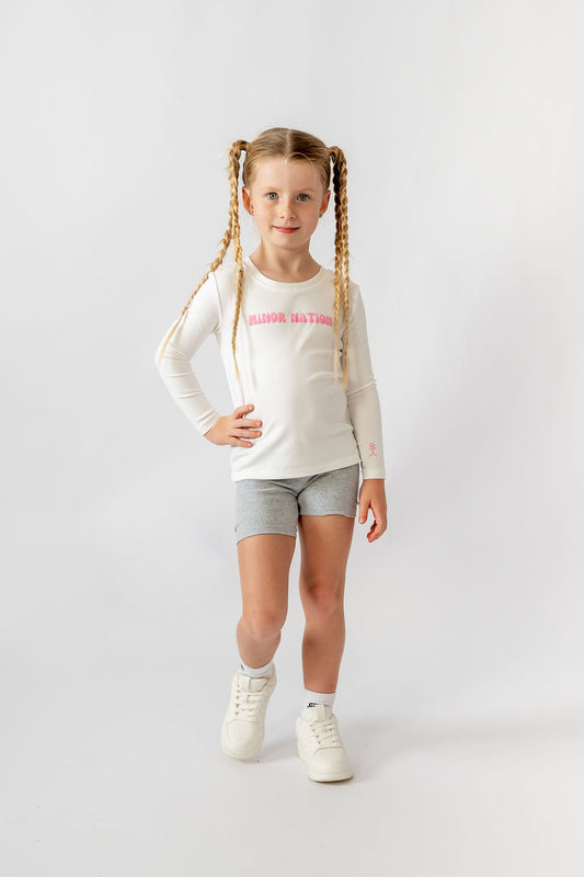 Product photo of Girls Elite Long Sleeve Top in Whitelaw 